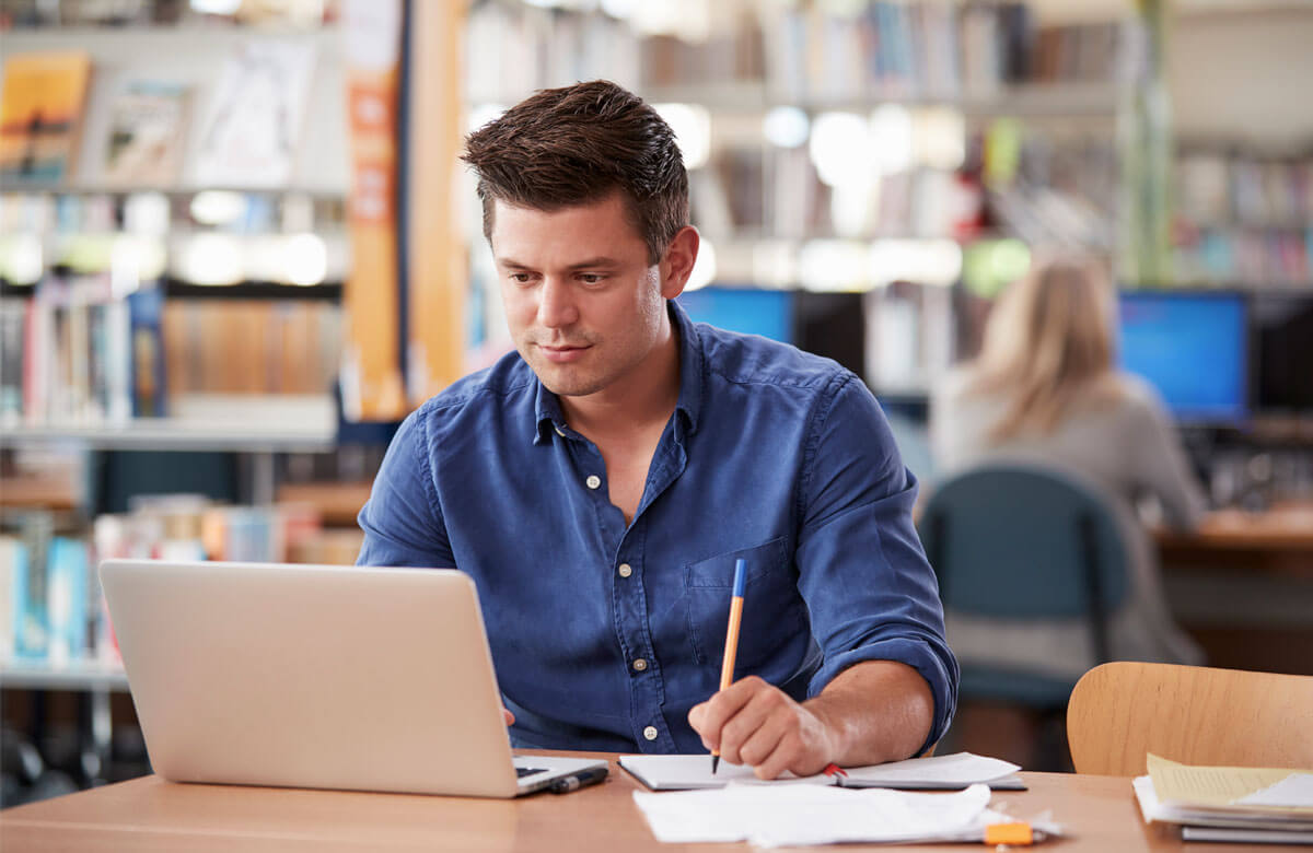 Student attending a live coaching session online via his laptop.