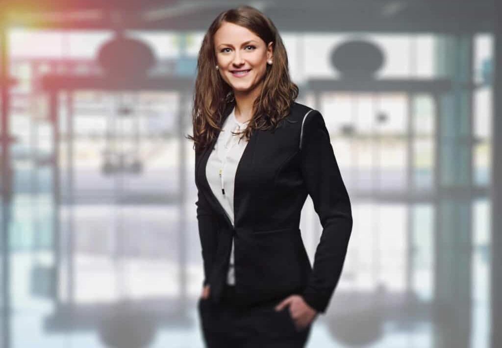 Executive Women in suit smiling and posing