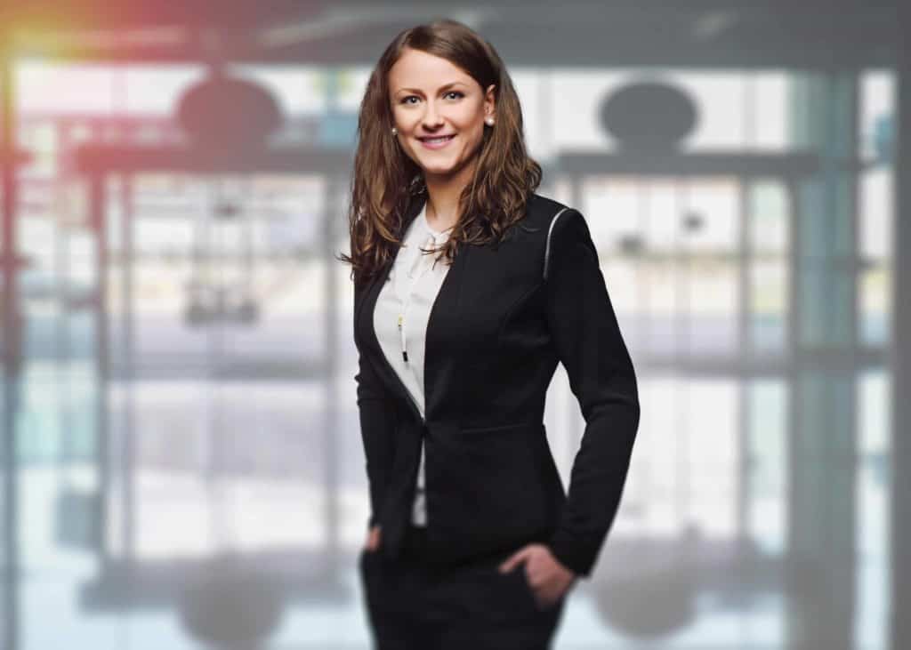 Executive Women in suit smiling and posing