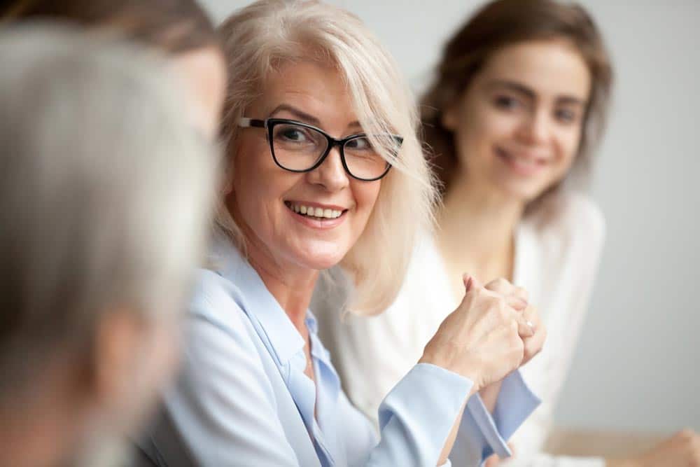 Woman Having A Conversation In A Group