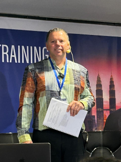 Course facilitator holding notes